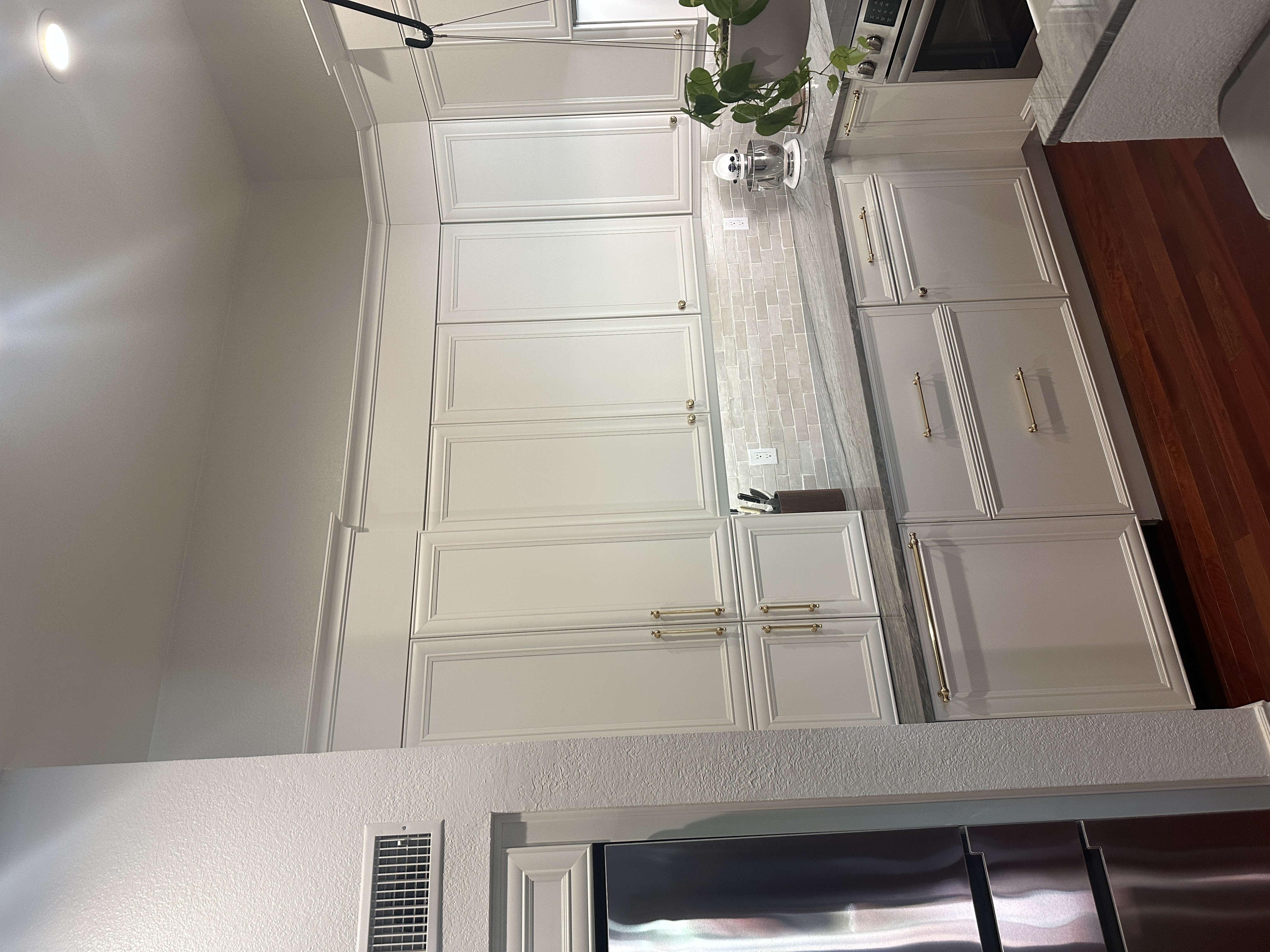 Custom white cabinetry with gold hardware