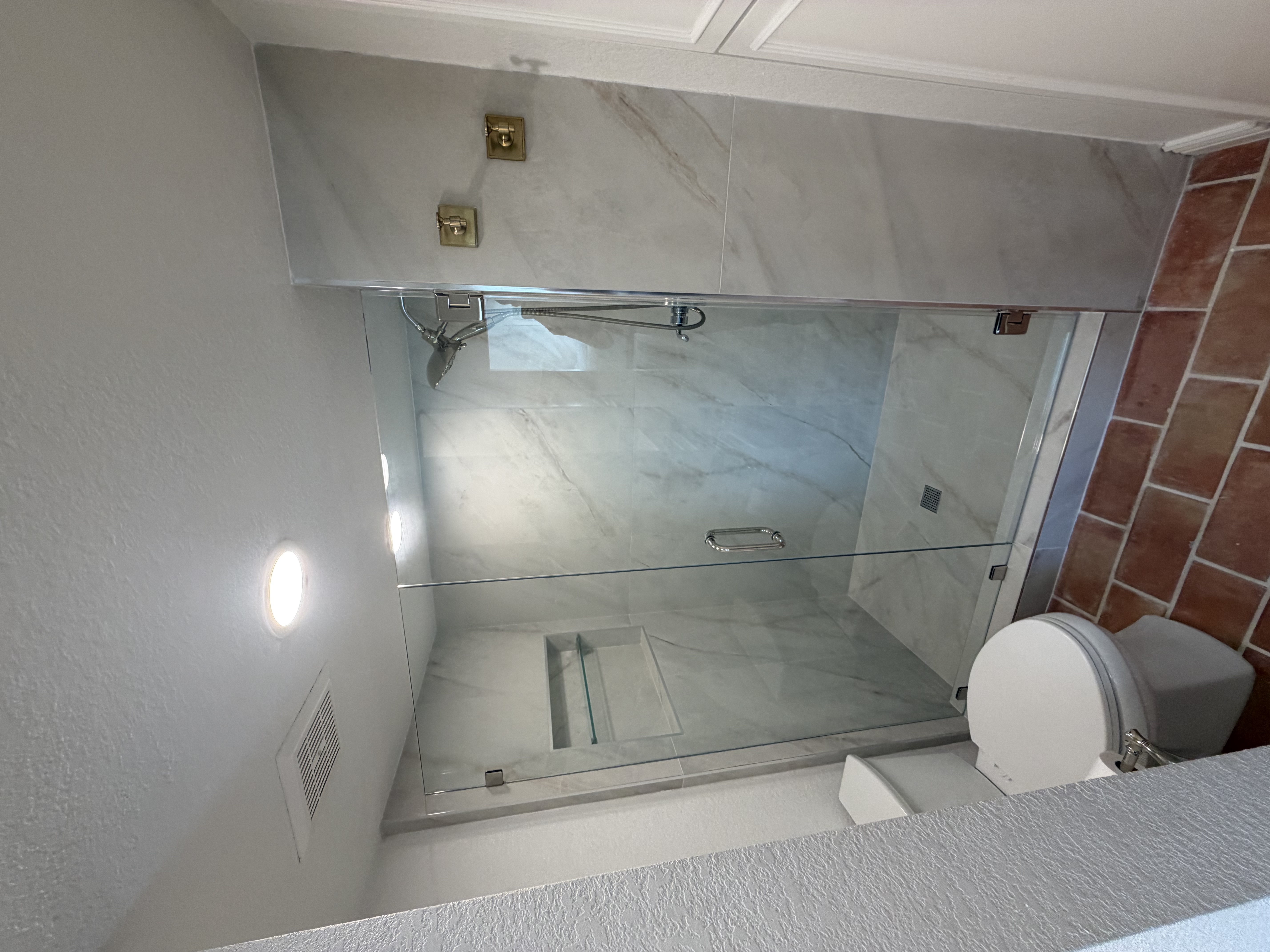 Luxury bathroom remodel with marble tile